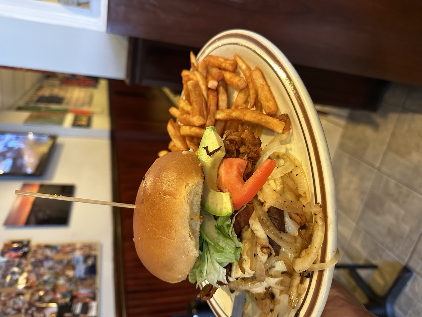 Gyro Palace burger with avocado, onions, and fries